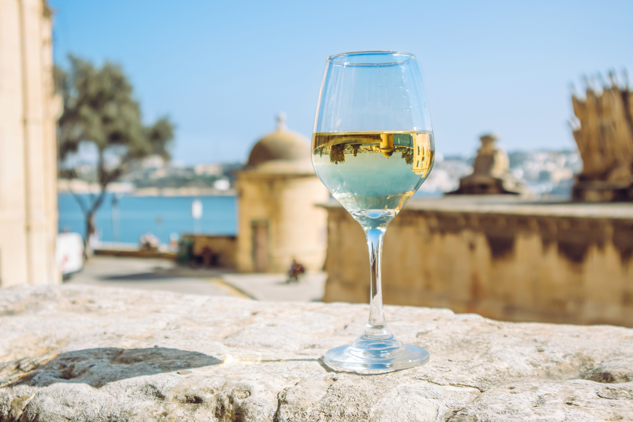 Glass of white wine in the beautiful city of Valletta