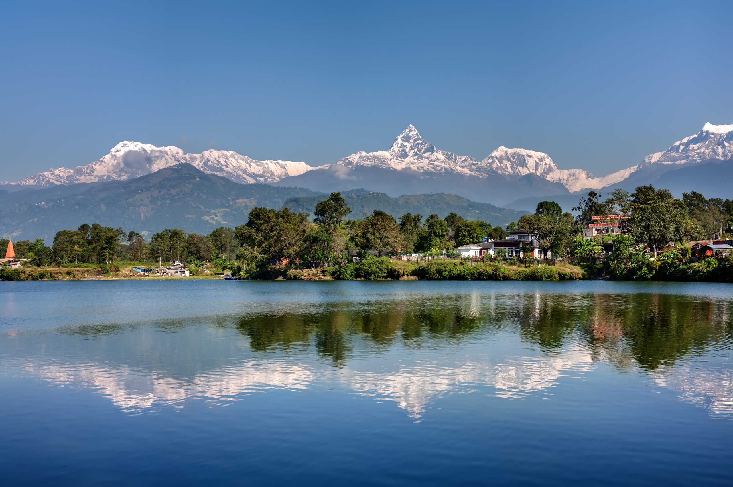 View at Annapurna mountain range and its reflection in Phewa lake in Pokhara, Nepal